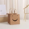 Kraft paper with an open smiling face, creative cartoon kraft paper bag, shopping clothing, kraft paper handbag, gift packaging Specification image
